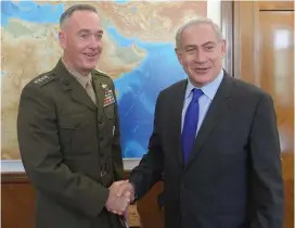  ?? (Amos Ben-Gershom/GPO) ?? PRIME MINISTER Benjamin Netanyahu welcomes Marine Corps Gen. Joseph Dunford, chairman of the US Joint Chiefs of Staff, in Jerusalem yesterday.