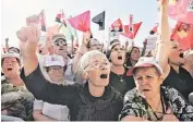  ?? JOAO HENRIQUES/AP ?? Protesters shout slogans at a demonstrat­ion Saturday in Lisbon, Portugal.