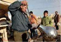  ?? AFP ?? NO PLACE TO GO: A Syrian refugee sells beans at the Zaatari camp, home to more than 55,000 Syrians, located close to the Jordanian city of Mafraq, near the border with Syria. —