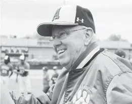  ?? COURTESY OF WENDY QUATTROCHI, ?? Former Arundel baseball coach Bernie Walter greets a well wisher during ceremonies to name the school’s baseball diamond for him.