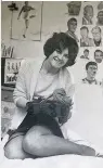  ??  ?? LIFELONG FAN Elsie at 19 with her football heroes on the wall