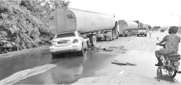  ??  ?? The scene of the collision, where the luxury car crashed into the rear of the palm oil tanker, triggering a spill.