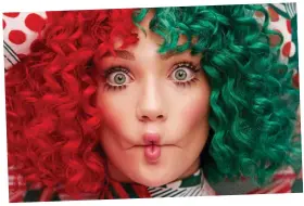  ??  ?? Wigging out: Australian singer Sia Furler is in a festive mood FROM poignant pop to country carols, music’s stars are rocking around the Christmas tree this year with new festive albums. ADRIAN THRILLS sorts the crackers from the turkeys . . .