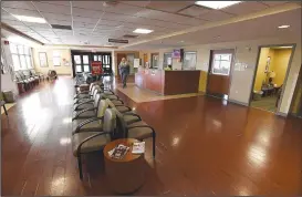  ?? NWA Democrat-Gazette/J.T. WAMPLER ?? Tiffany Means, emergency department director, walks through a nearly empty waiting room at the emergency room Feb. 26 at Northwest Medical Center’s Springdale campus.