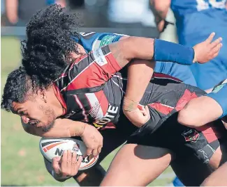  ?? Photo: KIRK HARGREAVES/FAIRFAX NZ ?? Canterbury half Tanu Suavine tries to bust through the Auckland defence.