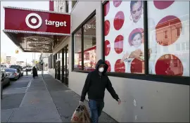  ?? MARK LENNIHAN — THE ASSOCIATED PRESS FILE ?? Target extended its strong sales streak through the holiday quarter and grabbed business from rivals. The Minneapoli­s-based discounter reported profit soared 66%, while sales jumped 21% for its fiscal fourth quarter.
