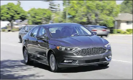  ?? NEWS GROUP/TNS ?? The author tested the semi-autonomous features in the Fusion and raved about the adaptive cruise control. However, braking, parking and lane-keeping features were less impressive.