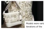  ??  ?? Models wore various iterations of the Chanel Gabrielle bag, in metallic leather or tweed. The embroidery on some of them echoed the upholstery of the Ritz Paris.