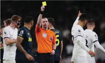  ?? Photograph: Paul Childs/Action Images/Reuters ?? Cristian Romero reacts as he is booked by the referee Chris Kavanagh during Tottenham’s 4-1 Premier League win over Newcastle.