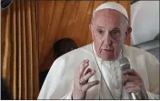  ?? TIZIANA FABI — POOL VIA AP ?? Pope Francis speaks with journalist­s on board an Alitalia aircraft enroute from Bratislava back to Rome, Wednesday after a four-day pilgrimage to Hungary and Slovakia.