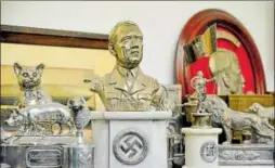  ?? REUTERS ?? In a hidden room in a house near Argentina’s capital Buenos Aires, police have found what they believe to be the biggest collection of Nazi artifacts in the country’s history, including a bust relief of Adolf Hitler and magnifying glasses inside...