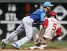  ?? LAURENCE KESTERSON — THE ASSOCIATED PRESS ?? The Phillies’ Nick Williams (5) is forced out at second as Cubs second baseman Tommy La Stella (2) throws to first on a single by Rhys Hoskins in the fourth inning Sunday.
