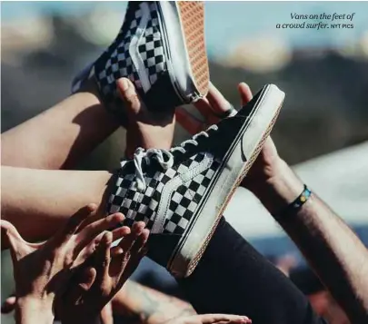  ?? NYT PICS ?? Vans on the feet of a crowd surfer.