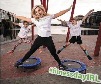  ?? BILLY STICKLAND/ INPHO ?? Cork camogie legend Anna Geary with Sibha Bhoja (9) and Conn McCluskey (8) in Dublin yesterday at the launch of Ireland’s National Fitness Day