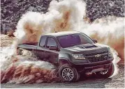  ??  ?? The Colorado ZR2 is offered with a choice of two powertrain­s: an all-new 3.6-liter V-6 that delivers 308 horsepower and 275 lb.-ft. of torque and a 2.8-liter Duramax turbo I-4 that produces 181 horsepower and 369 lb.-ft. of torque.