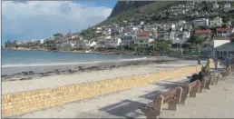  ??  ?? LIFE IS BEACH: Fish Hoek beach with its landmark catwalk.