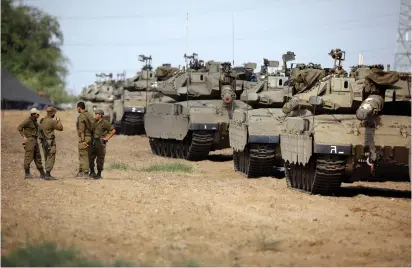  ?? (Reuters) ?? TANKS NEAR the border with Gaza.