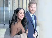  ??  ?? Britain’s Prince Harry and his wife Meghan, Duchess of Sussex react as they leave after their visit to Canada House in London, Britain early this month.