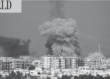  ?? ABDULMONAM EASSA / AFP / GETTY IMAGES ?? Smoke plumes rise above the rebel-held town of Hamouria, in the besieged Eastern Ghouta region on the outskirts of Damascus following a reported regime airstrike. Thousands of families are sheltering in basements in the area.