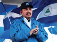  ??  ?? Ortega applauds during a march in Managua, Nicaragua. — Reuters photo