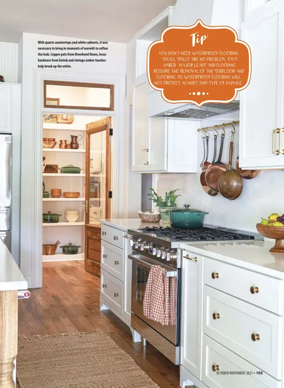  ??  ?? With quartz countertop­s and white cabinets, it was necessary to bring in moments of warmth to soften the look. Copper pots from Riverbend Home, brass hardware from Emtek and vintage amber touches help break up the white.