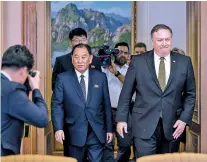  ?? ANDREW HARNIK/ASSOCIATED PRESS ?? Secretary of State Mike Pompeo, right, and Kim Yong Chol, a North Korean senior ruling party official and former intelligen­ce chief, return to discussion­s Saturday at Park Hwa Guest House in Pyongyang, North Korea.