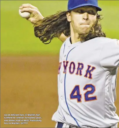  ??  ?? Jacob deGrom fans 13 Marlins but is lifted for reliever Fernando Salas, who blows lead in Mets’ frustratin­g loss to Marlins. GETTY