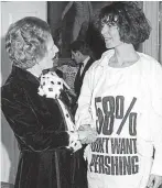  ?? ?? Protest: T-shirt-clad Katharine throws away gong in video. Right, CND message with Thatcher in 1984