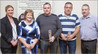  ??  ?? Duty Manager of the Parkview Hotel Cliona McGloughli­n, Martha O’Toole and Eoin Devlin present Paddy Fox and Mick Farrell of Avonmore F.C. with the Pat O’Toole Division 2 Manager of the Year Award.