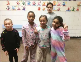  ?? EVAN BRANDT — MEDIANEWS GROUP ?? From left, Adrianna Lawder, 8, Aliya Stillman, 8, Maliyah DavidHeise­r, 10, Jesus Nego, 10 and Jeanah Verdone, 9, hang out in their PJs at the Ricketts Community Center in the after-school program.