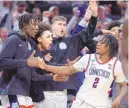  ?? ASSOCIATED PRESS ?? UConn guard Tristen Newton (2) celebrates with teammates while the Huskies pull away from San Diego State in the second half of their NCAA Tournament Sweet 16 game on Thursday in Boston.