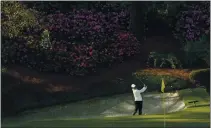  ?? DAVID J. PHILLIP — THE ASSOCIATED PRESS ?? Rory McIlroy, of Northern Ireland, hits from the bunker on the 13th hole during a practice round for the Masters tournament on Tuesday.