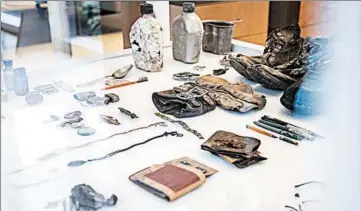  ?? MARIE ERIEL S. HOBRO/FOR THE WASHINGTON POST ?? Belongings of deceased soldiers sit on a table at the Defense Department's state-of-the-art forensic lab in Honolulu.