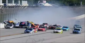  ?? JERRY MARKLAND, GETTY IMAGES ?? Cars begin to pile up during a crash at Talladega Superspeed­way on May 7.