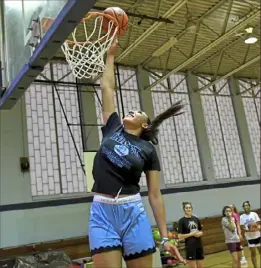  ?? Matt Freed/Post-Gazette ?? Pine-Richland's Eve Fiala attempts a dunk during a Western Pa. Bruins AAU practice April 29 at Grandrew Montessori on Mt. Washington.