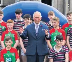  ??  ?? Prince Charles with pupils from St Patrick’s Grammar School, Armagh and The Royal School, Armagh, during a visit to Northern Ireland last year