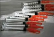  ?? ASSOCIATED PRESS FILE PHOTO ?? Syringes loaded with the Moderna COVID-19 vaccine
