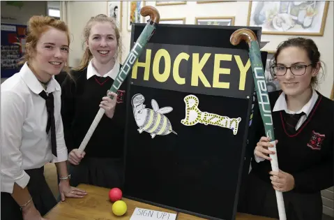  ??  ?? Moya Healy, Maeve O’Doherty and Anna Barnwell looking for new hockey players during Loreto Freshers Week.