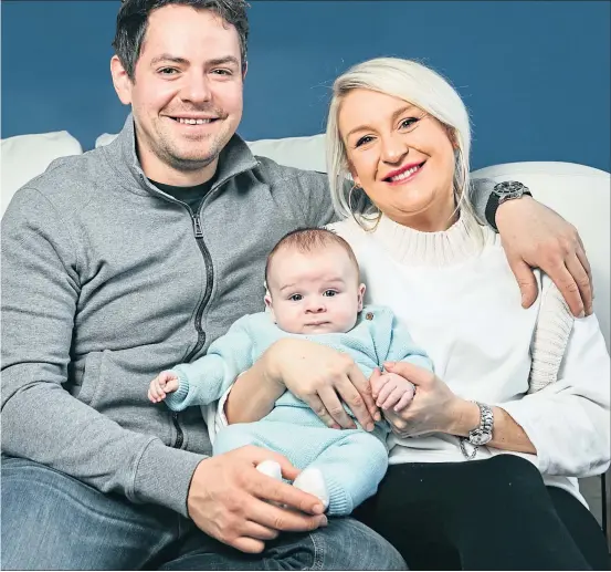  ?? Picture Andrew Cawley ?? Sarah Ballantyne and John Bell with baby Jack at home in Glasgow