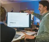  ?? STEPHEN BRASHEAR/AP ?? Microsoft employee Alexander Campbell demonstrat­es the integratio­n of the Bing search engine and Edge browser with OpenAI on Feb. 7 in Redmond, Wash.