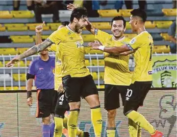  ?? PIC BY ABDULLAH YUSOF ?? Perak’s Ronaldo Silva (left) celebrates his goal against Perak SEDC in Saturday’s FA Cup quarter-final return leg match at Perak Stadium.