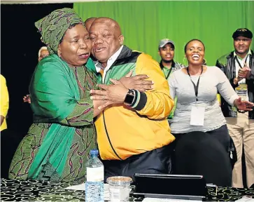  ?? /Jackie Clausen (See Page 3) ?? Best of friends: ANC MP and presidenti­al hopeful Nkosazana Dlamini-Zuma made an impromptu appearance at the KwaZulu-Natal provincial general council that nominated her on Tuesday, and then went on to address the body. She is seen here hugging provincial chairman Sihle Zikalala.