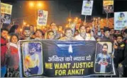  ?? HT ?? Friends, relatives and locals carried out a candleligh­t march in Raghubir Nagar to demand justice for Ankit Saxena.