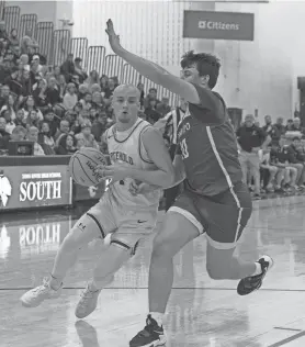  ?? PETER ACKERMAN/THE ASBURY PARK PRESS ?? Freehold Borough’s Christian DeGiso works in against Ramapo’s Peyton Seals during the NJSIAA Group 3 final in Toms River on March 10.