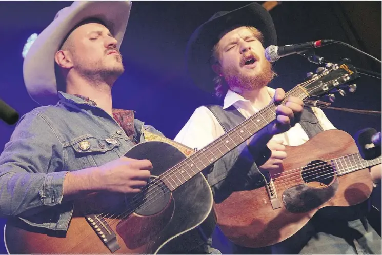  ??  ?? Killing it at the Starlite Room Monday night, Blake Berglund joins Colter Wall on stage.