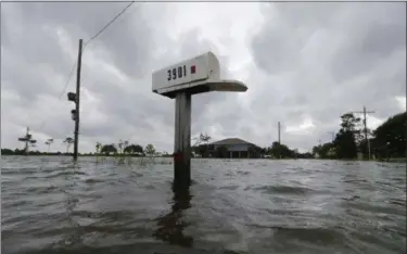  ?? GERALD HERBERT — THE ASSOCIATED PRESS ?? A mailbox sticks out of water during neighborho­od flooding after Tropical Storm Cindy, now downgraded to Tropical Depression Cindy, in Big Lake, La., Thursday.