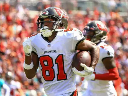  ?? AFP/VNA Photo ?? FAKER: Tampa Bay Buccaneers receiver Antonio Brown scores a touchdown in an NFL game against the Miami Dolphins.