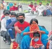  ?? RAVI KUMAR/HT ?? People wait to register themselves for special trains to their home towns, in Chandigarh on Wednesday.