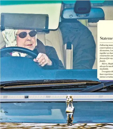  ??  ?? The Queen driving in the grounds of Sandringha­m yesterday before news broke of the terms of the separation agreement