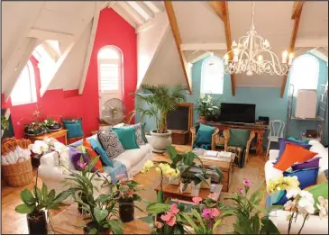  ?? Chef and KWV ambassador Mynhardt Joubert’s living room is brightly painted and filled with plants and artwork. ??